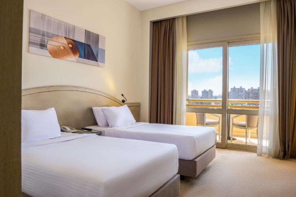Изображение Triumph Plaza Hote 4*