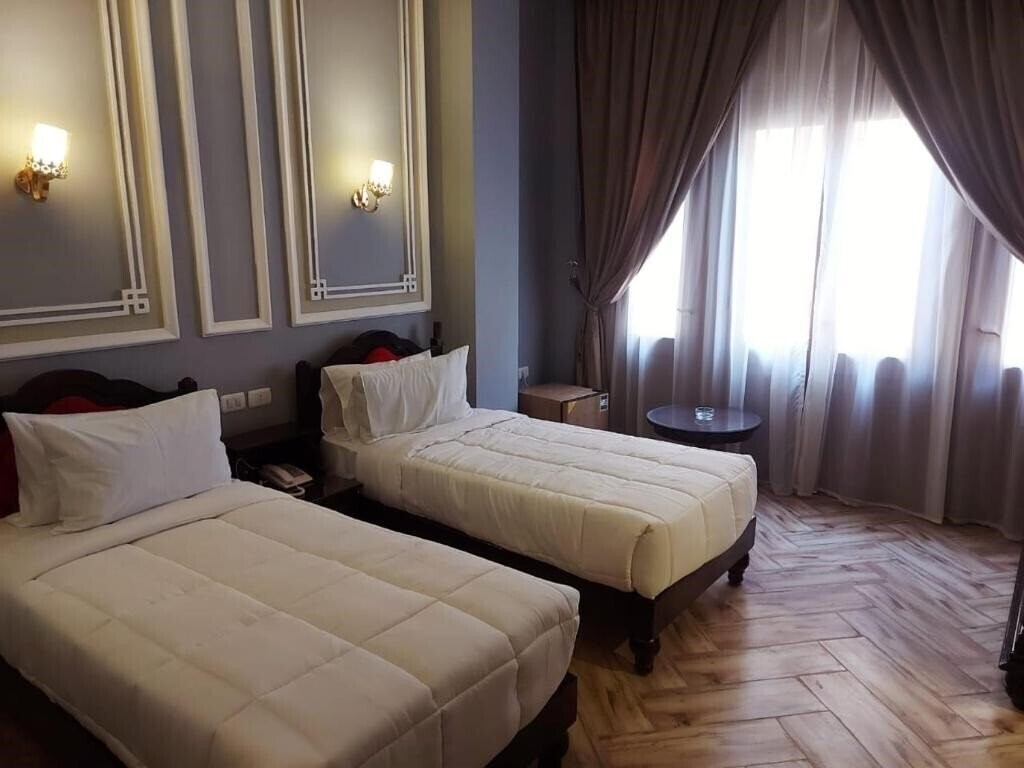 Фотография Cosmopolitan Plaza Inn 4*