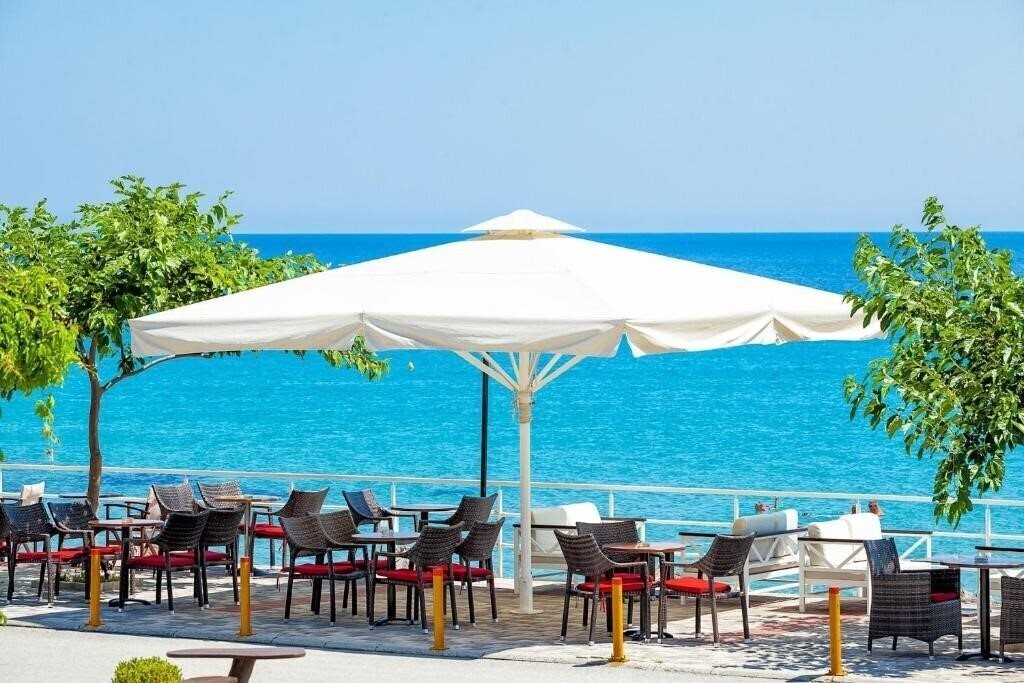 Фотография Xenios Dolphin Beach 3*