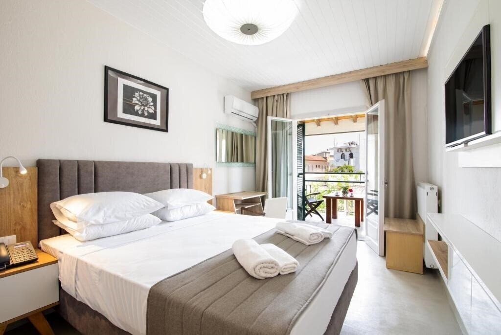 Фото Across Opera Blue (ex. Omiros Hotel) 4*