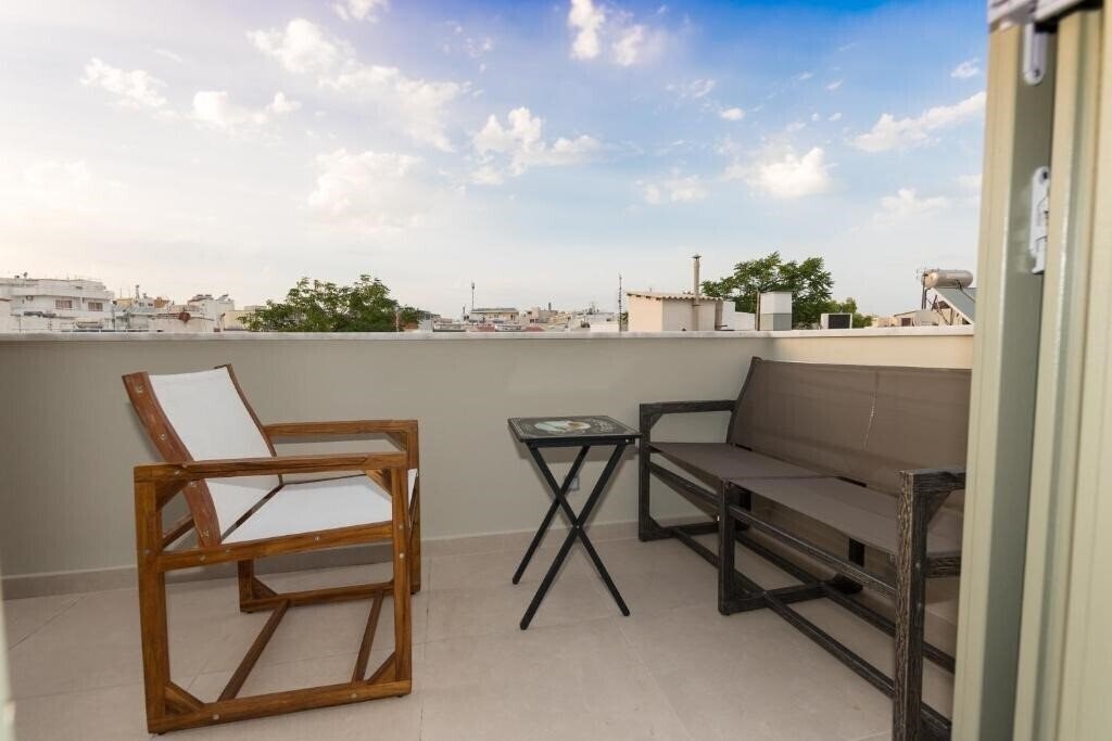 Отель Faces Art Suites 4*