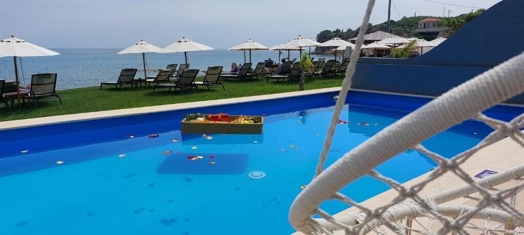 Фотография Cavo Orient Beach Hotel & Suites 4*