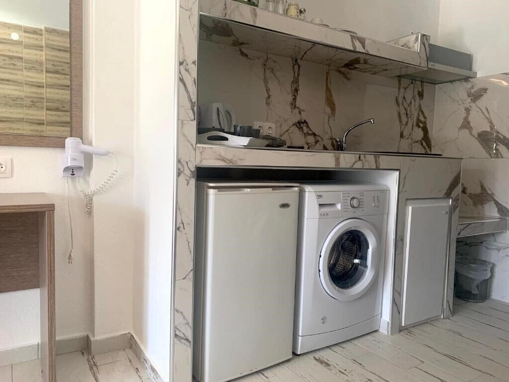 Polykratis Rooms Apart Hotel 4* суреті