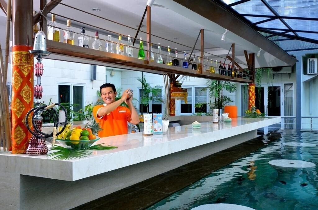 Фотография Harris Hotel & Residences Riverview Kuta 4*
