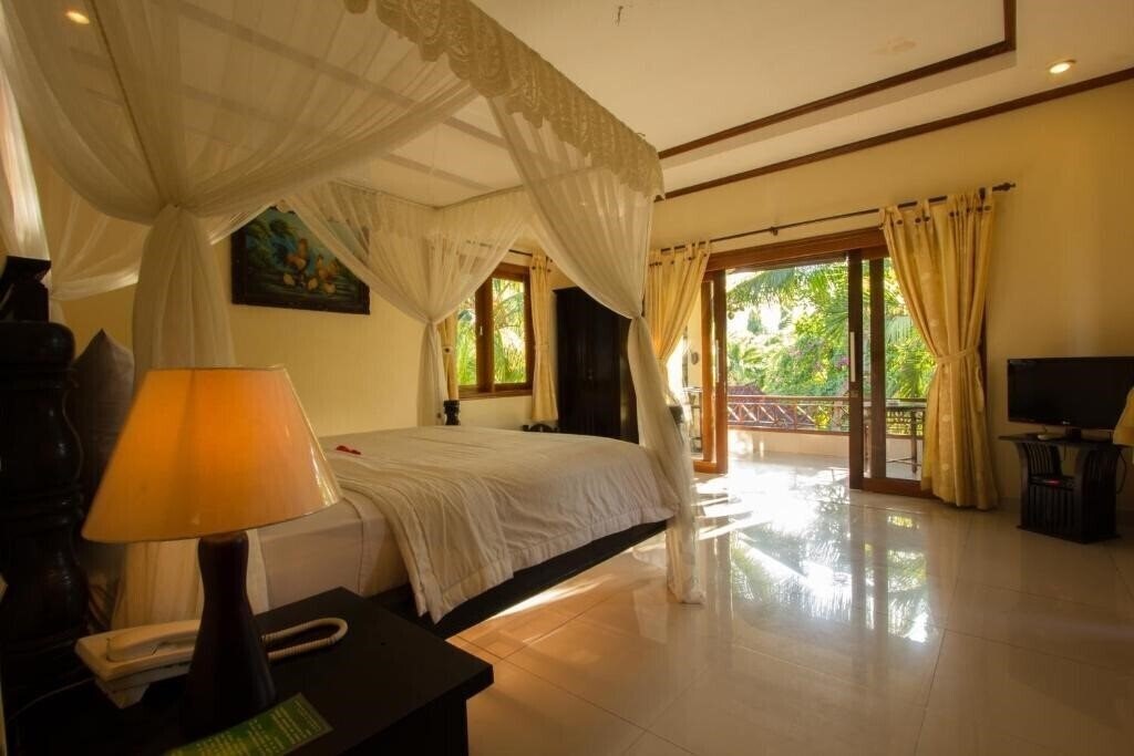 Фото Arya Amed Beach Resort 4*