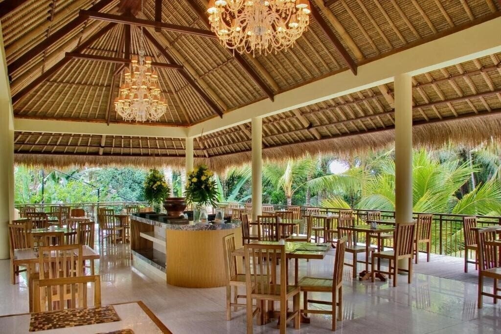 Komaneka at Rasa Sayang 4* суреті