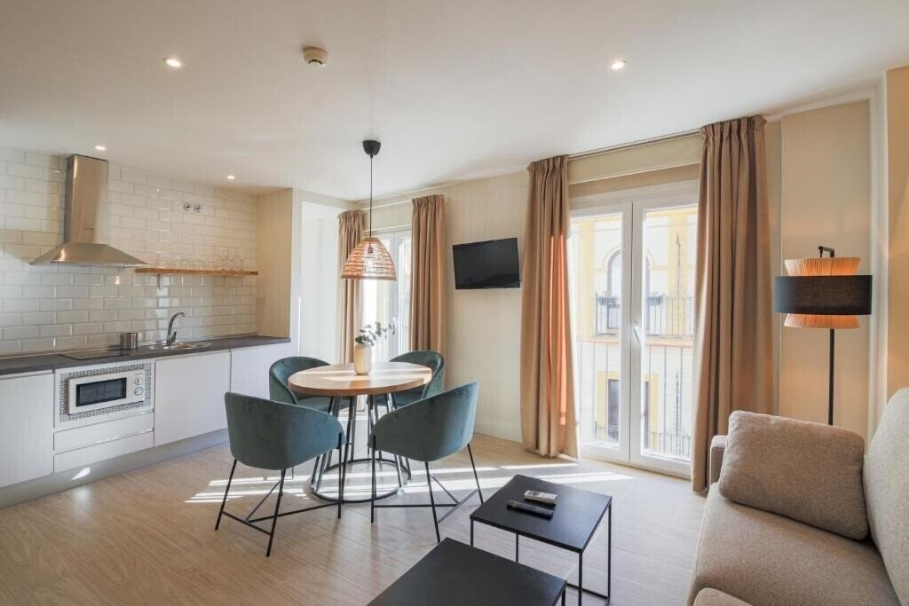 Фото Magna Sevilla Apartamentos 3*