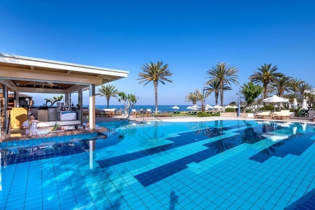 Фото Constantinou Bros Athena Beach Hotel 4*