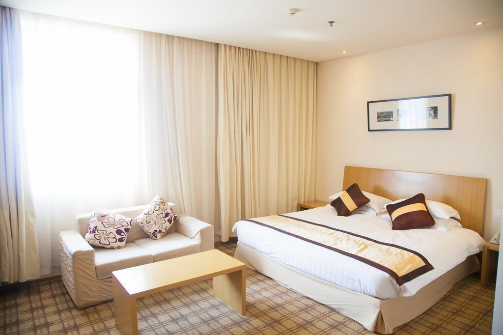 Фото Traveler Inn Huaqiao Beijing 3*
