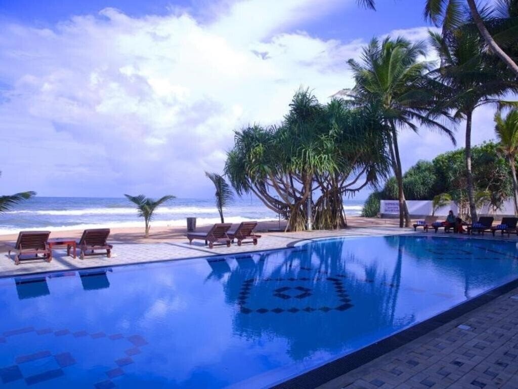 Картинка Whispering Palms 3*