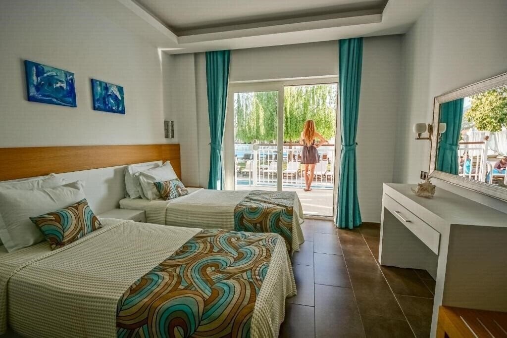 Фото Mozaik Boutique Apartments 4*