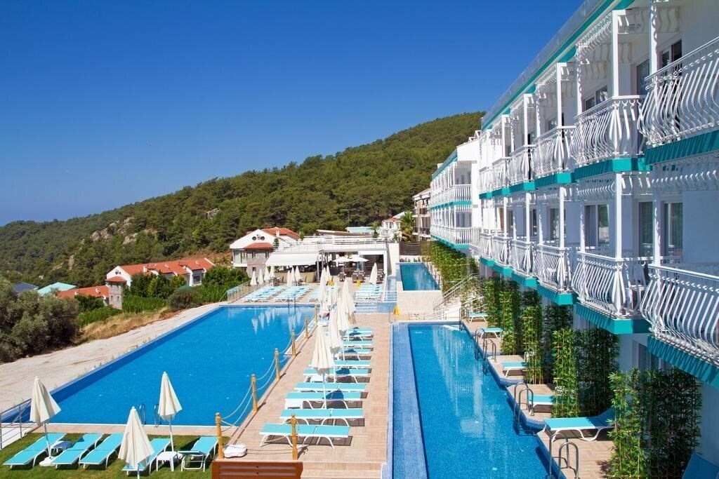 Sertil Deluxe Hotel & SPA (ex. Tropical Suites by Sertil, Ramada by Wyndham Fethiye Oludeniz) 4* суреті
