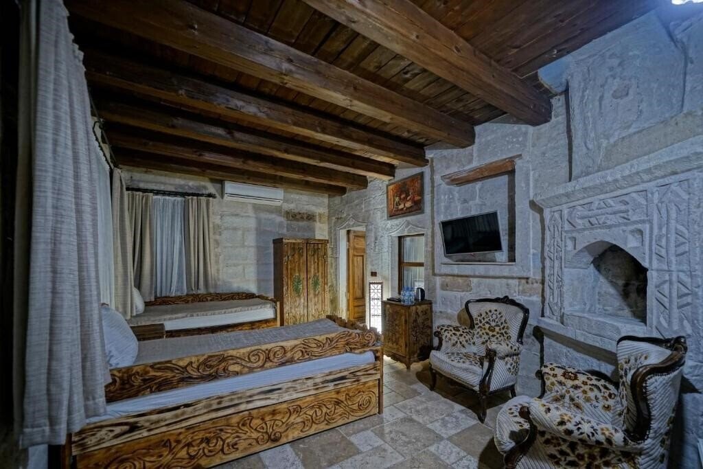 Фото Holiday Cave Hotel (ex. Flintstones Cave) 3*