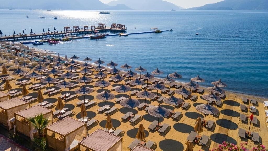 Фото Hotel Caprea Beach (ex. Dora Beach Boutique Hotel, Dora Beach Marmaris, Karacan Beach) 4*
