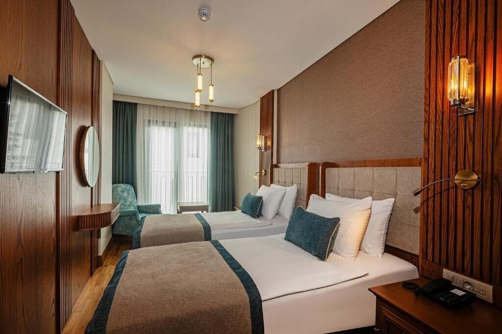 Triton Hotel (ex. Azade Hotel, Best Western Obelisk) 4* суреті